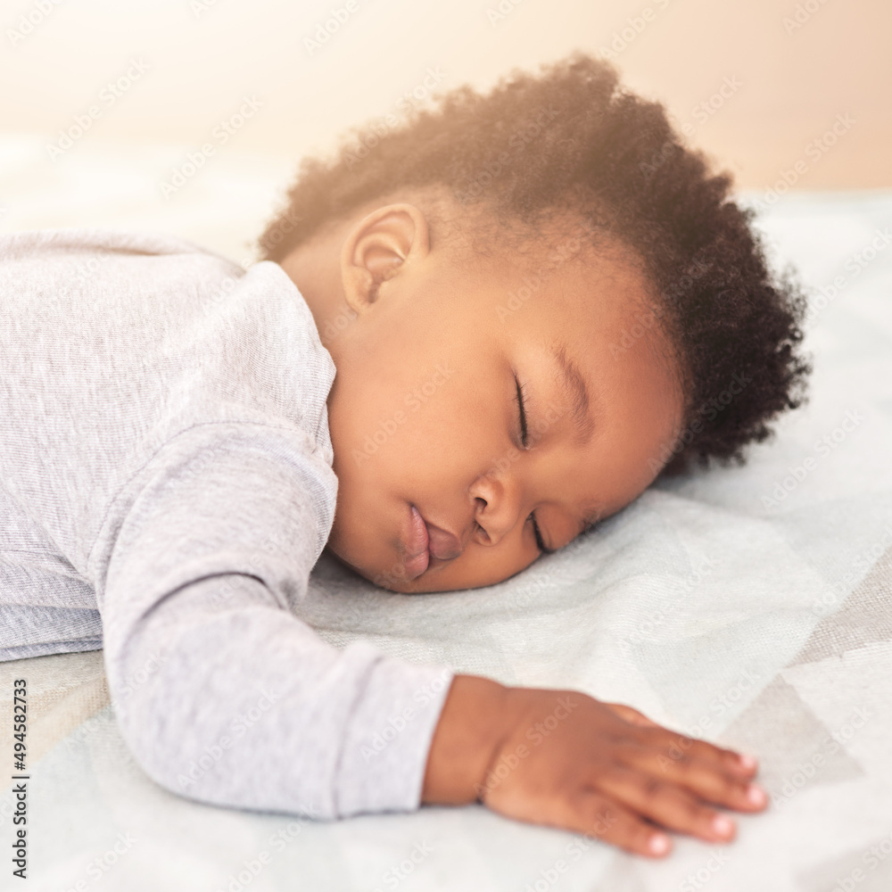 Lost in adorable dreams. Shot of a little baby boy sleeping on a bed. Lost in adorable dreams. Shot of a little baby boy sleeping on a bed.