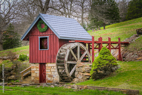 vintage hillside waterwheel turbine red wooden hunt mountain stream raised water shed