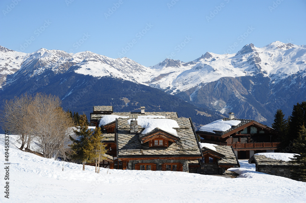 Ski resort with beautiful chalets in front of Mont Blanc.