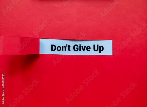 The torn red paper appeared with the words Don’t Give Up.