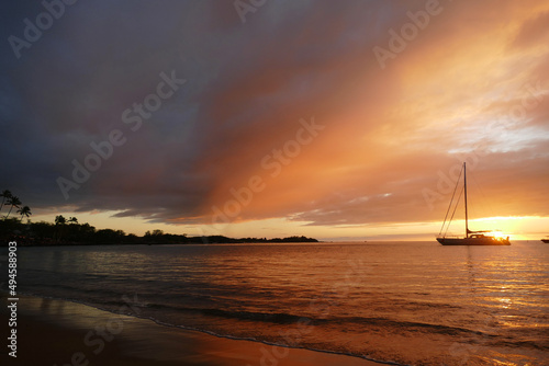 sunset in Hawaii with sailboat © Todd