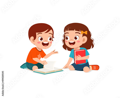 little boy and girl read book together