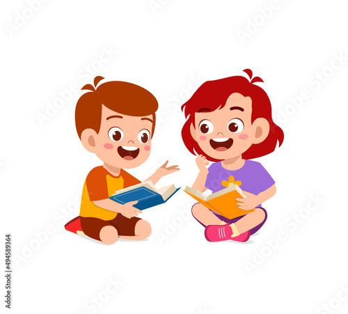 little boy and girl read book together