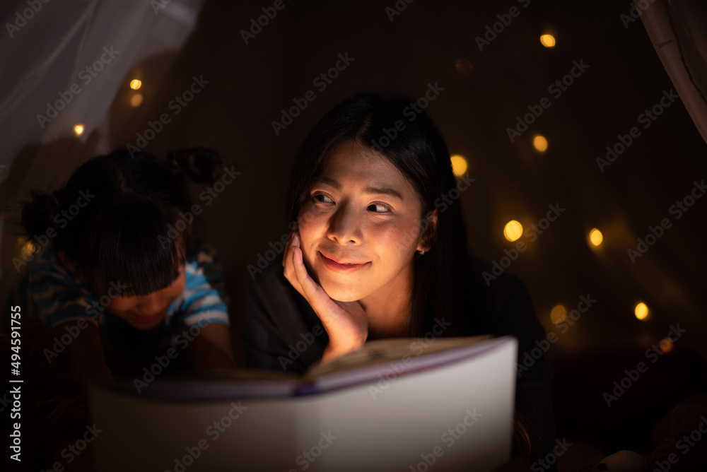 education learning concept with homework, young woman teaching to daughter at home