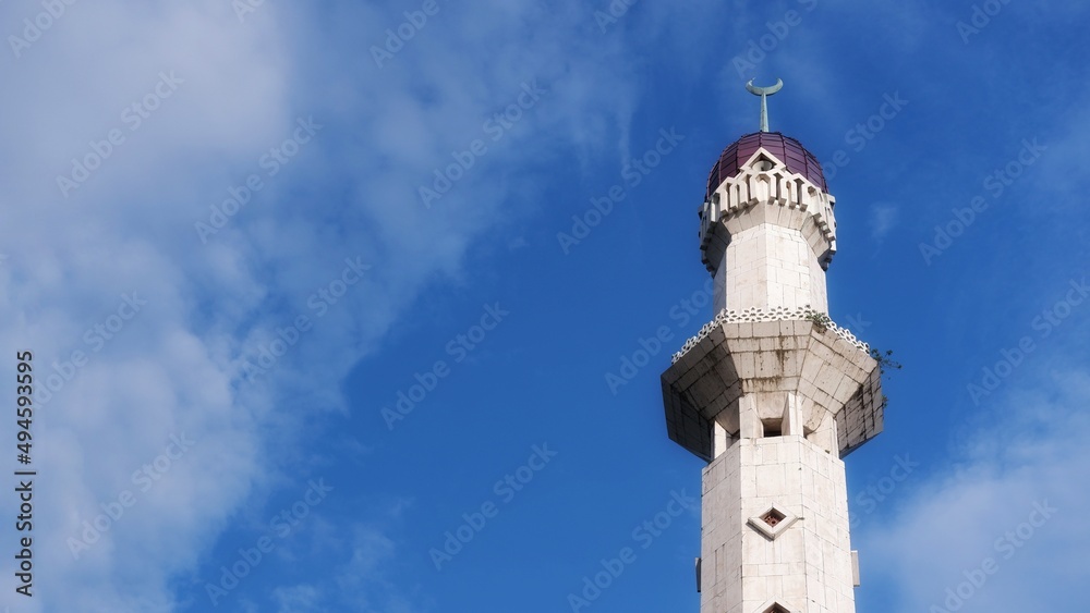 Mosque tower with blue sky background and copy space for text 