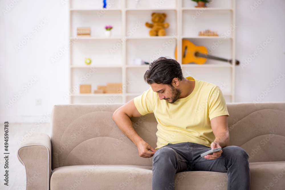 Young man sitting at home during pandemic Young man sitting at home during pandemic