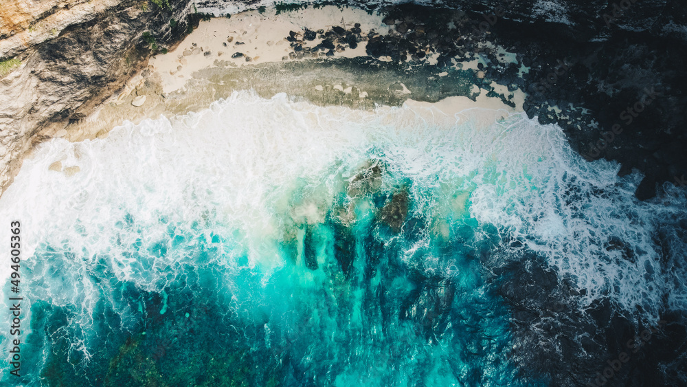 Aerial view to ocean waves. Blue water background