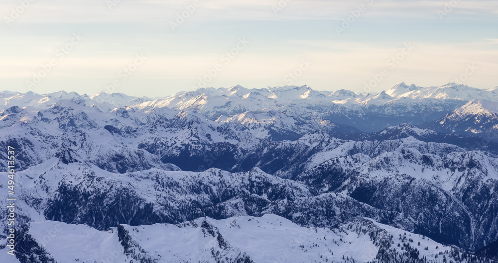 Obraz premium Aerial Panoramic View of Canadian Rocky Mountain Landscape. Cloudy Sunset Sky. Located near Vancouver, British Columbia, Canada. Nature Background Panorama