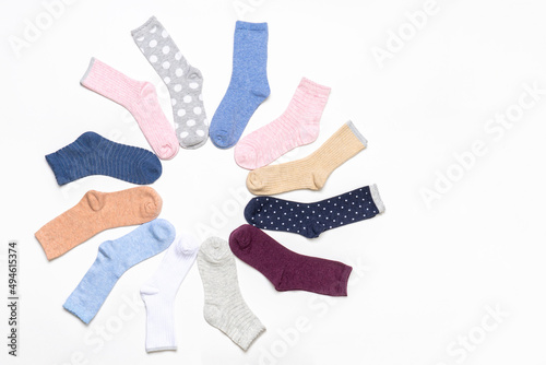 Various modern trendy women's cotton socks set on white background. Fashionable socks store. Socks shopping, sale, merchandise, advertisement concept