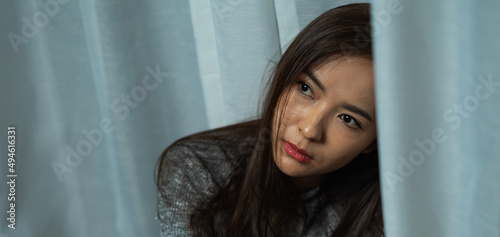 Close up young woman sitting sad at sunshade, depression emotion on face, looking copy space in room, Portrait of young beautiful woman or female or girl sitting expression depression emotional alone © Chaiya