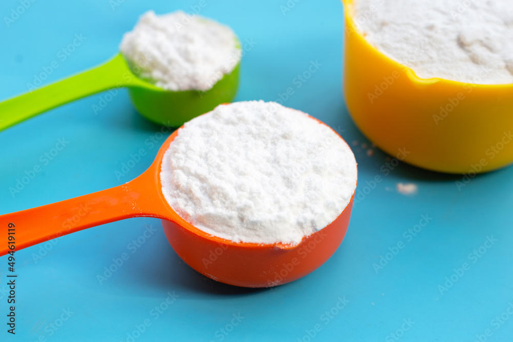 Baking soda on blue background. Baking soda on blue background.
