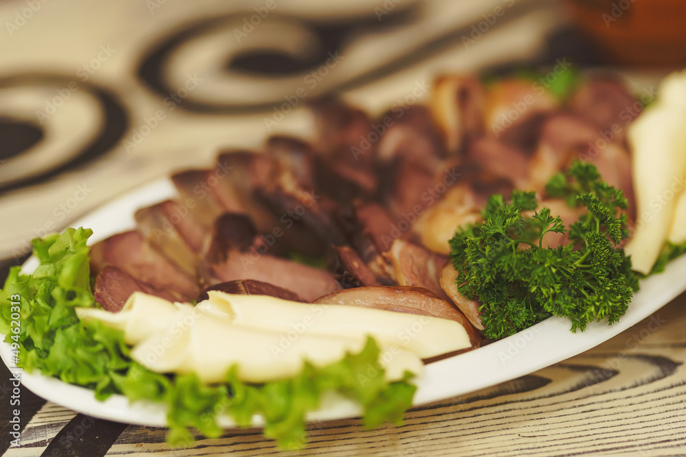 Slicing meat sausage from horse meat is a national Kazakh dish on the