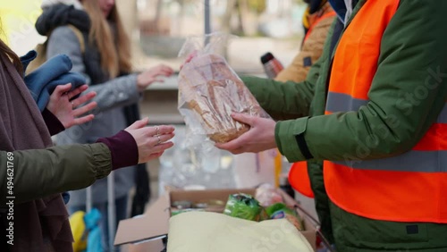 Volunteers distributing blankets and other donations to refugees on the Ukrainian border. photo