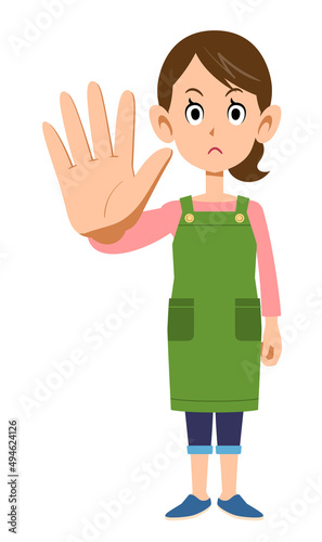拒否するエプロンを着用した女性

