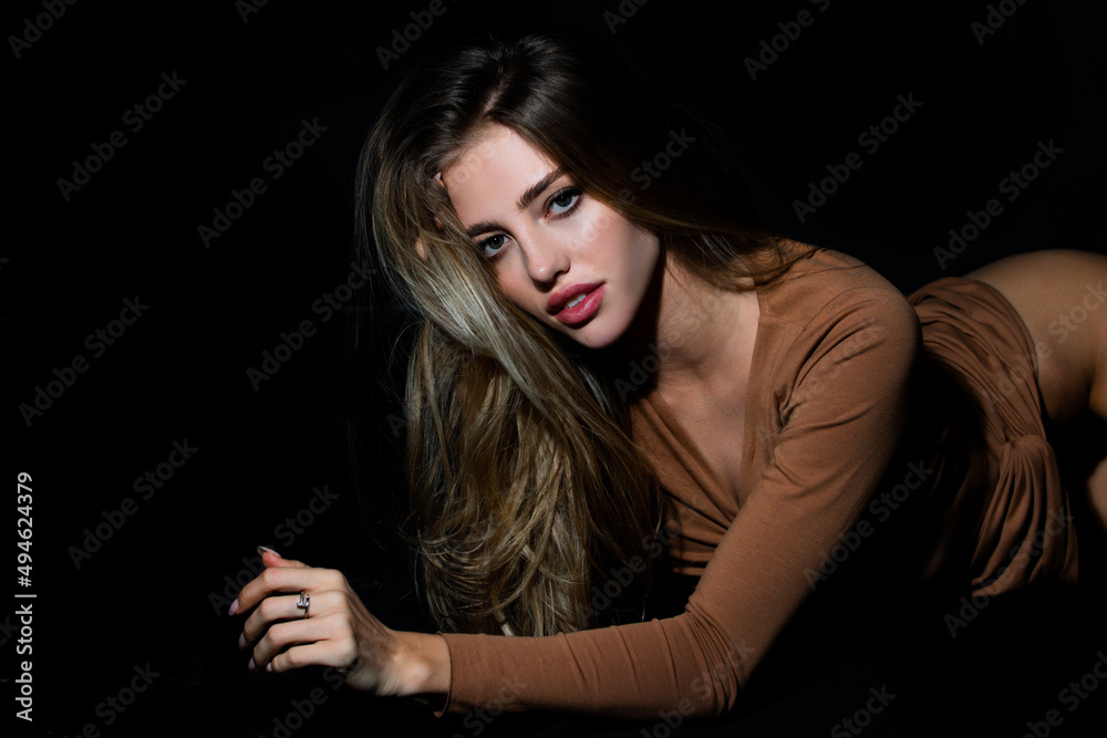 Sensual lady in erotic dress. Nice fit slim attractive tender sweet romantic girl lying on black bad. Portrait of a charming sexy sensual beautiful woman with fashion dress. Sensual lady in erotic dress. Nice fit slim attractive tender sweet romantic girl lying on black bad. Portrait of a charming sexy sensual beautiful woman with fashion dress.