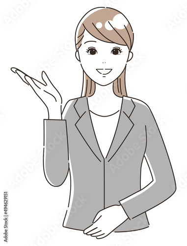 案内するスーツを着た女性（上半身）