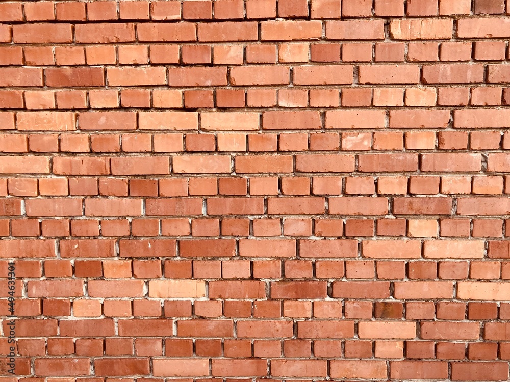 Obraz premium A wall made of red old bricks 