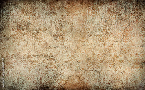 Worn wallpaper with floral patterns on dirty, cracked wall. Backgrouds and textures. Copy space, add text illustration