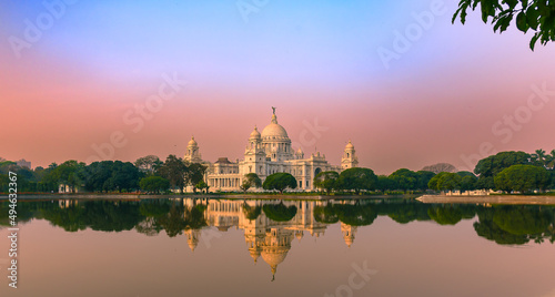 View of a large marble building in Central Kolkata, Named as The Victoria Memorial ,a which was built between 1906 and 1921. Foreground is Blurred and Selective Focus is used. photo