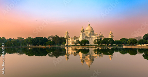 View of a large marble building in Central Kolkata, Named as The Victoria Memorial ,a which was built between 1906 and 1921. Foreground is Blurred and Selective Focus is used. photo