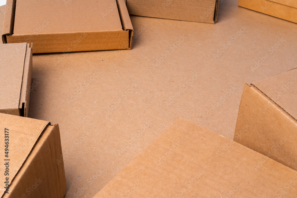 Cardboard box on beige background in studio Cardboard box on beige background in studio