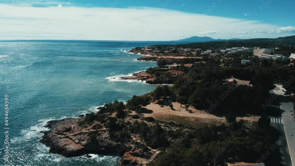 Crane shot from the shore of Ametlla de mar in Tarragona, Catalonia, Spain - aerial view Crane shot from the shore of Ametlla de mar in Tarragona, Catalonia, Spain - aerial view