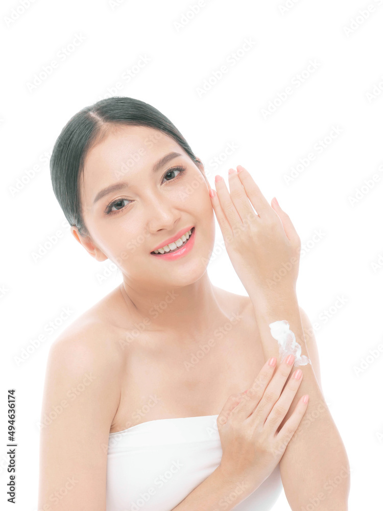 Beautiful young Asian woman applying body lotion natural cream on her arm after shower with clean skin , Fresh skin , on white background - Facial treatment , Cosmetology , beauty and spa concept Beautiful young Asian woman applying body lotion natural cream on her arm after shower with clean skin , Fresh skin , on white background - Facial treatment , Cosmetology , beauty and spa concept