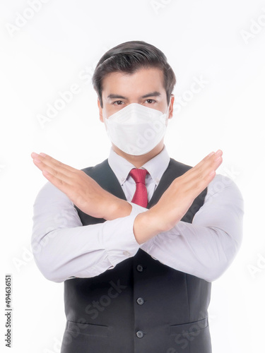 Stop Civid-19 , Asian man wearing Face Mask show stop hands gesture for stop corona virus outbreak , protect spread Covid-19 Coronavirus and protect pm 2.5 concept