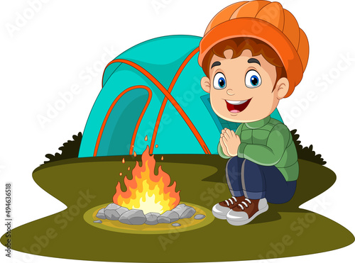 Cartoon little boy camping near campfire and tent