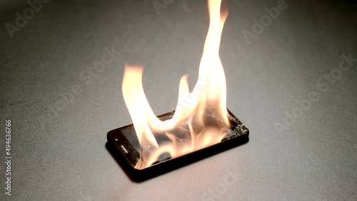 SLOW MOTION: Smartphone burning on a floor