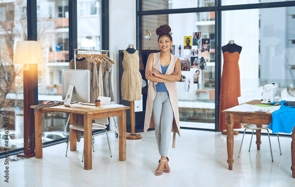 Fototapeta premium Turn your hobby to something that brings you funds. Portrait of a young fashion designer posing with her arms crossed in her workshop.