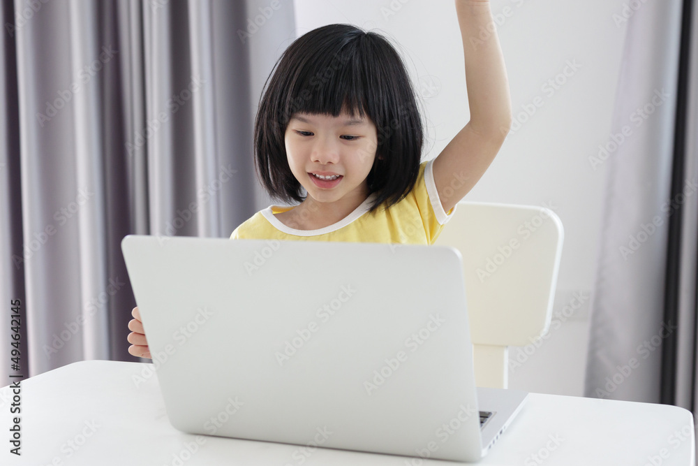 little asian girl student study online using laptop computer at home little asian girl student study online using laptop computer at home