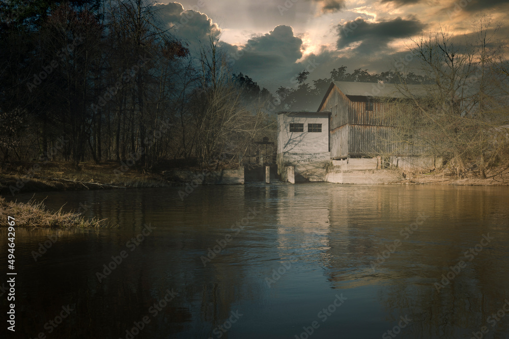 Obraz premium Palace, water mill and other historic buildings from the Polish countryside.