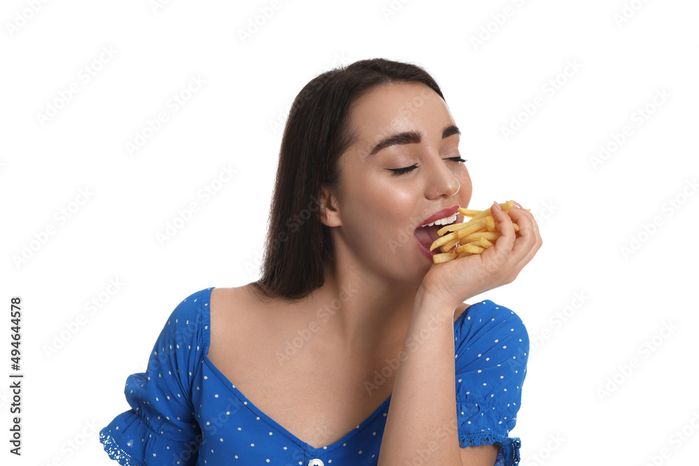 Beautiful young woman eating French fries on white background Beautiful young woman eating French fries on white background