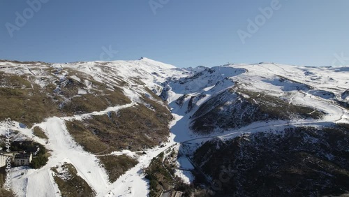 Ski resort in Sierra Nevada, Spain. Aerial backward and Sky for copy space