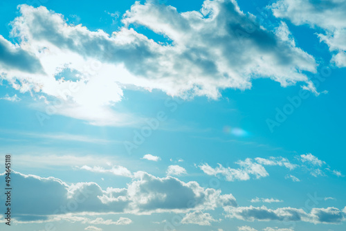 Beautiful sunset cloudy blue sky evening.Landscape sun sunrays through the white clouds.