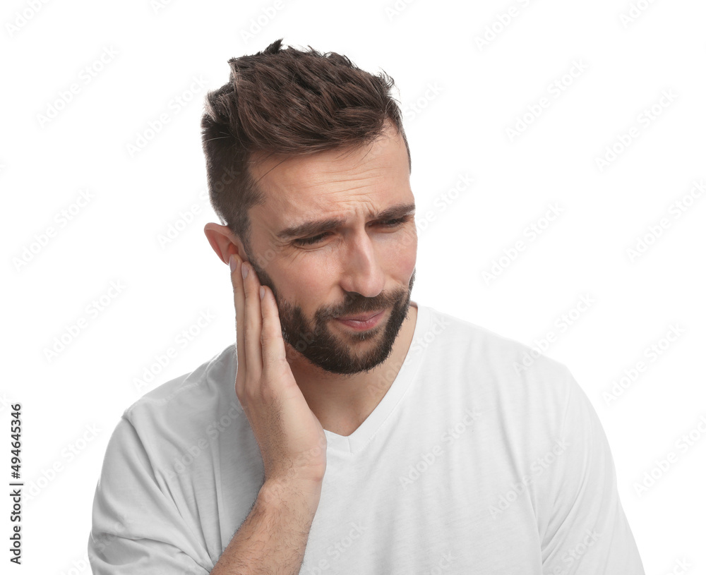 Man suffering from ear pain on white background