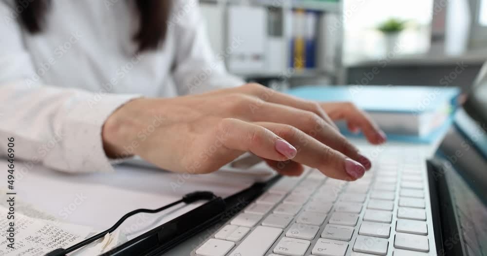 Person is typing on keyboard in office closeup Person is typing on keyboard in office closeup