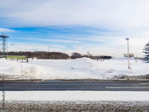 Snowy roadway by an airport (Chitose, Hokkaido, Japan)
