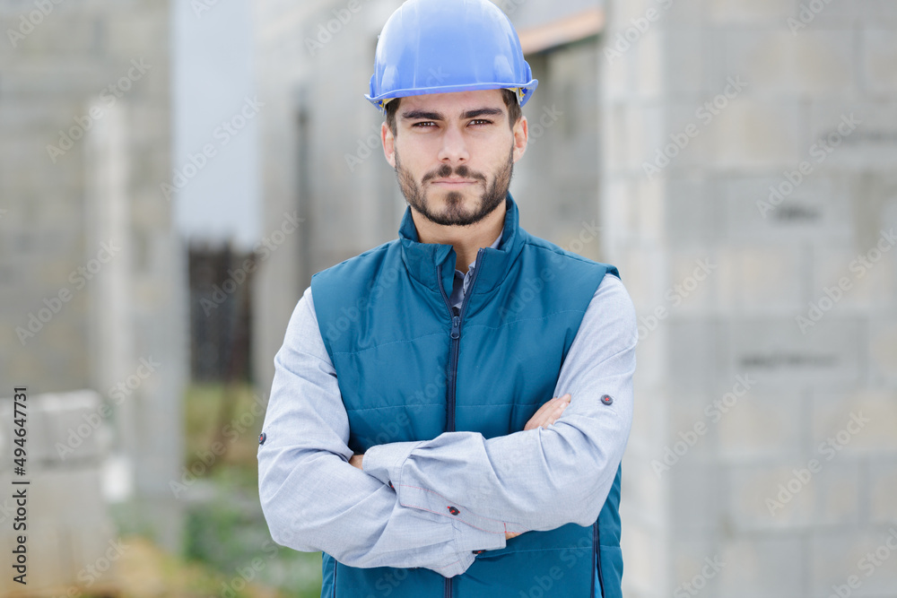 young handsome man construction worker standing outdoors young handsome man construction worker standing outdoors