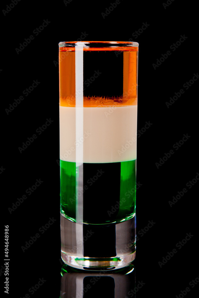 short layered alcoholic cocktail on black background short layered alcoholic cocktail on black background
