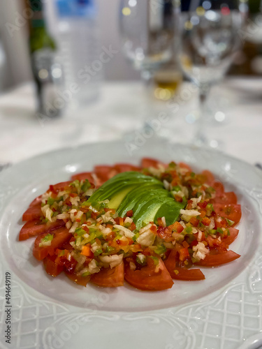 Tomato salad with onions, avocado and green peppers