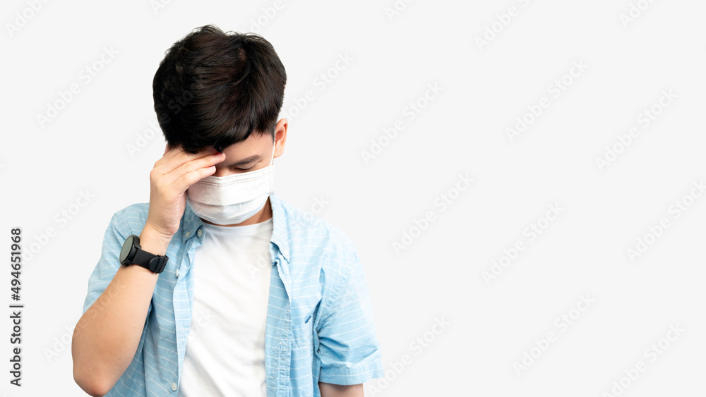 Teen Mental Health During COVID-19 concept. Portrait of an asian teenager boy with medical face mask, face down hands cover his face. Stressful, Anxiety, Illness, Infected, Cyberbully, Pandemic. Teen Mental Health During COVID-19 concept. Portrait of an asian teenager boy with medical face mask, face down hands cover his face. Stressful, Anxiety, Illness, Infected, Cyberbully, Pandemic.