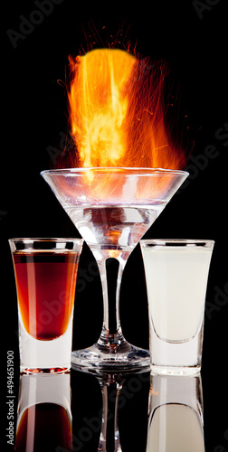 fired alcoholic cocktail isolated on black