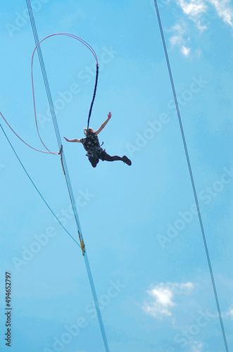 girl jumping with a rope on the background of the forest
