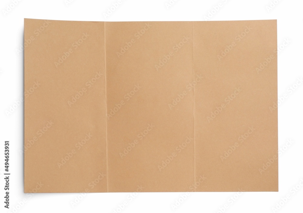 Sheet of brown paper on white background, top view