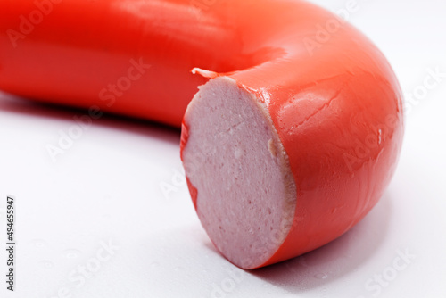 falu sausage on white background with water drops photo