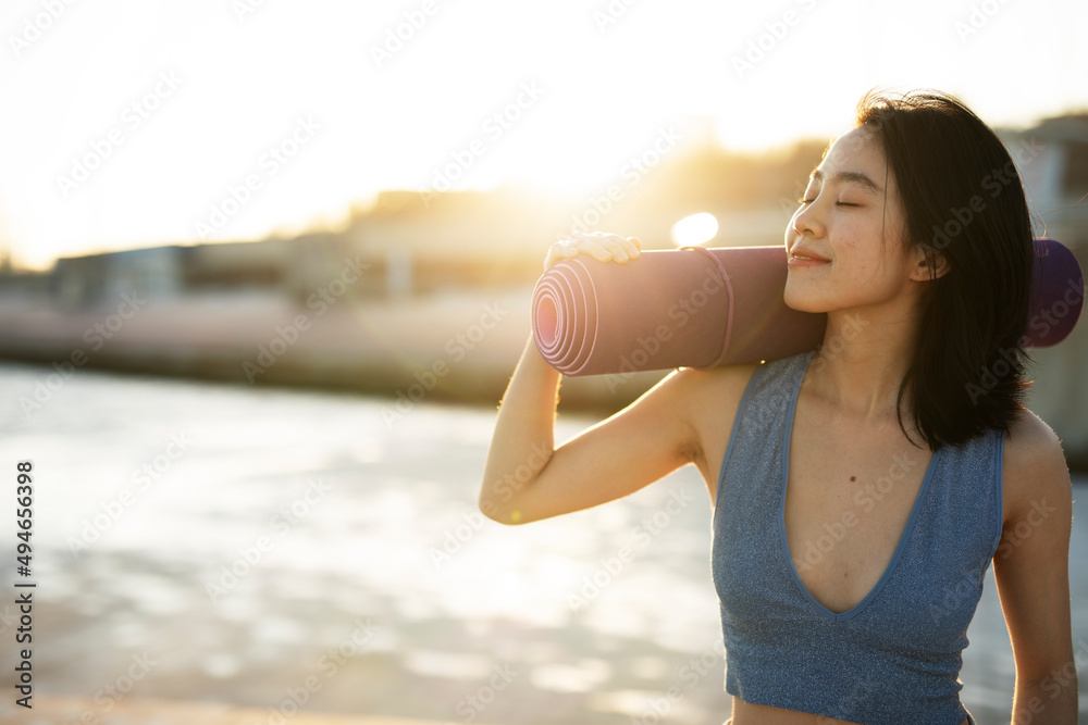 Beautiful young woman training outside. Fit woman doing stretching exercise. Beautiful young woman training outside. Fit woman doing stretching exercise.