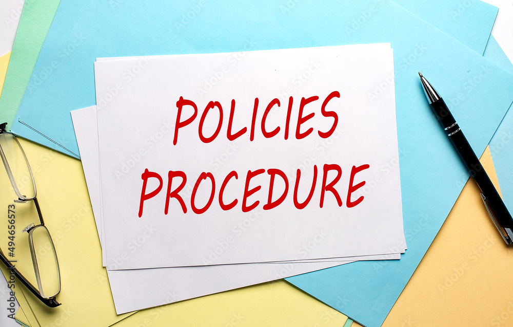 POLICIES PROCEDURE text on paper on colorful paper background POLICIES PROCEDURE text on paper on colorful paper background