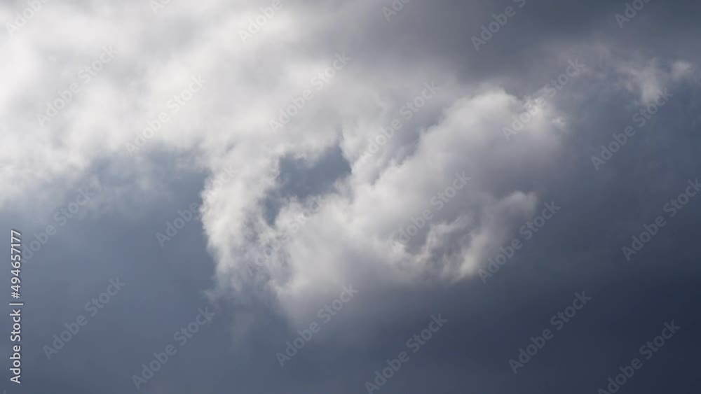 Close up dramatic eddy clouds moving in atmosphere - stormy weather conditions Close up dramatic eddy clouds moving in atmosphere - stormy weather conditions